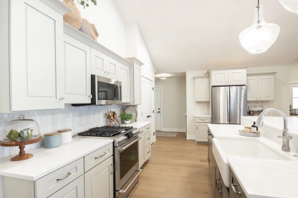 Gray mist perimeter cabinets with included appliances & an upgraded Farmhouse sink